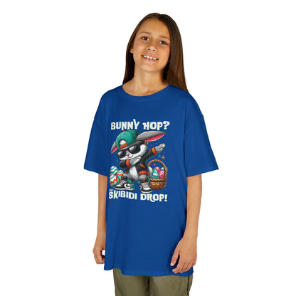 Blue Easter bunny T-shirt modeled by a girl, featuring skibidi drop text. A fun, bold shirt radiating skibidi sigma rizz energy for Easter. Hop into the season in style and shop Easter shirts online today!
