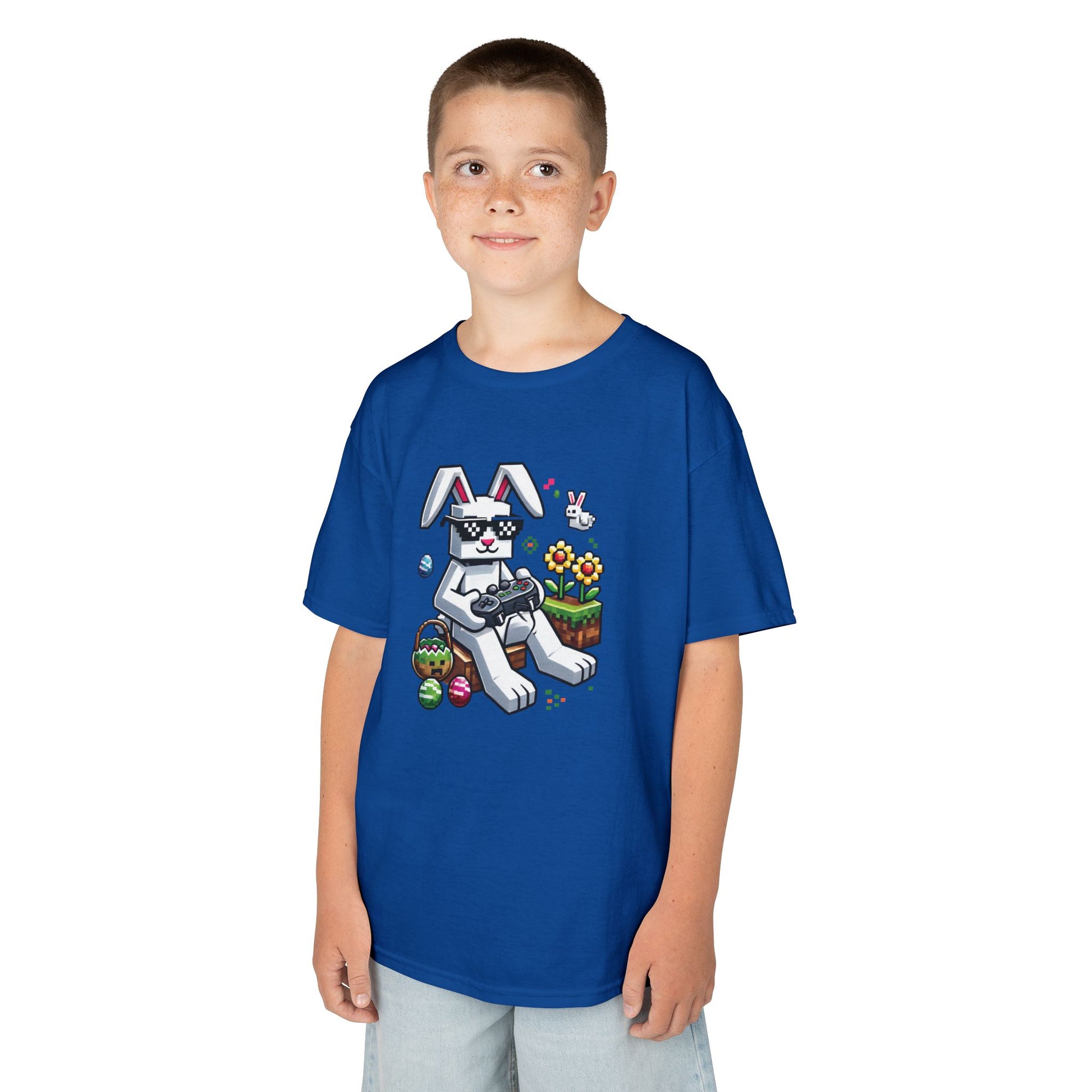Child wearing a blue Easter T-shirt with a Minecraft-inspired bunny and eggs, a fun and festive gaming look. Hop into the season in style and shop Easter shirts online today!