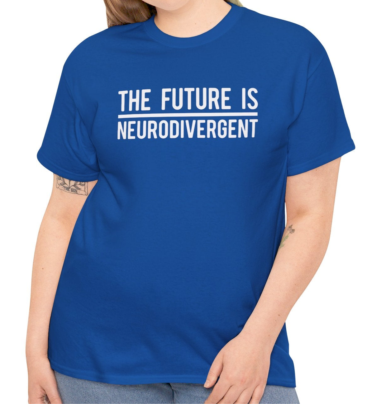 Model wearing a blue T-shirt with the text "The Future is Neurodivergent" in bold white letters. Part of the Vivid Divergence Sensory Friendly Unisex Tees Range.