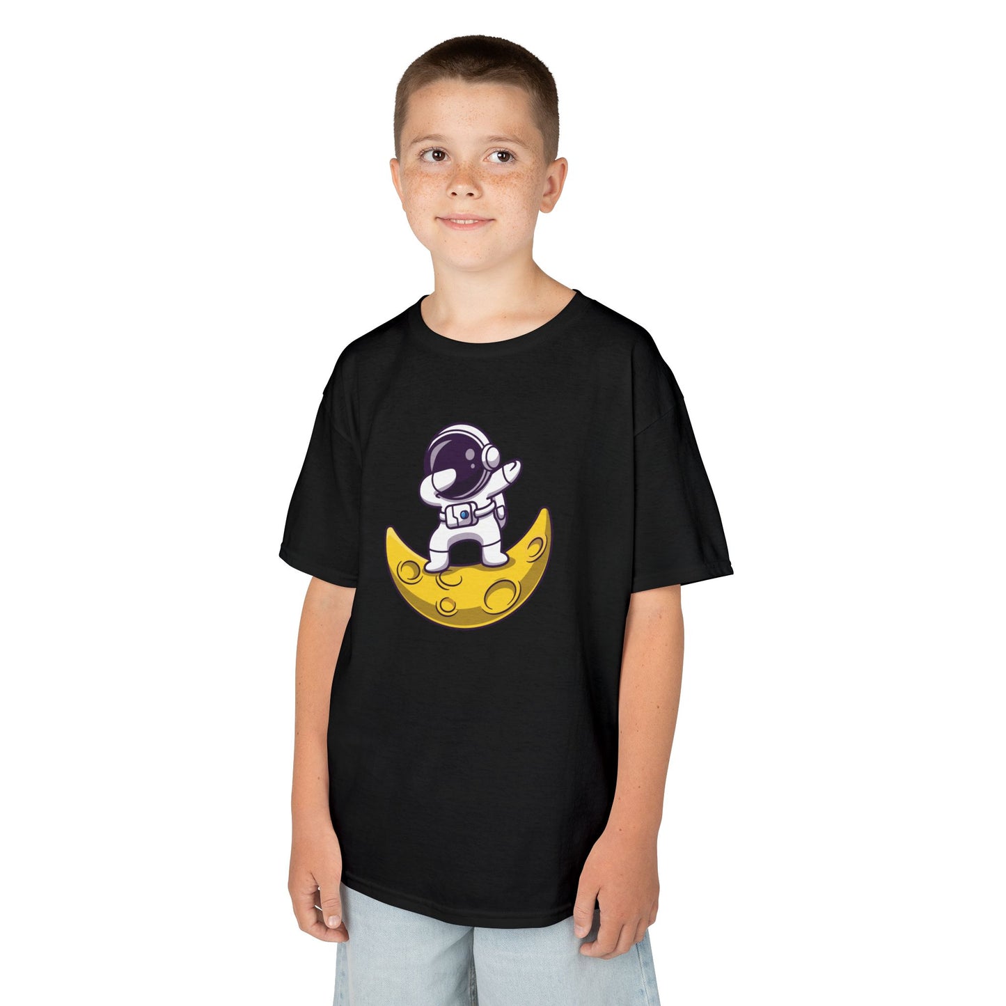 Boy wearing a black "Dabbing Astronaut on the Moon" kids T-shirt with an astronaut dabbing while sitting on a crescent moon. Part of the Vivid Divergence Sensory Friendly Kids Shirts Range. The perfect T-shirt for sensory-sensitive kids and comes with a Sensory Satisfaction Promise.