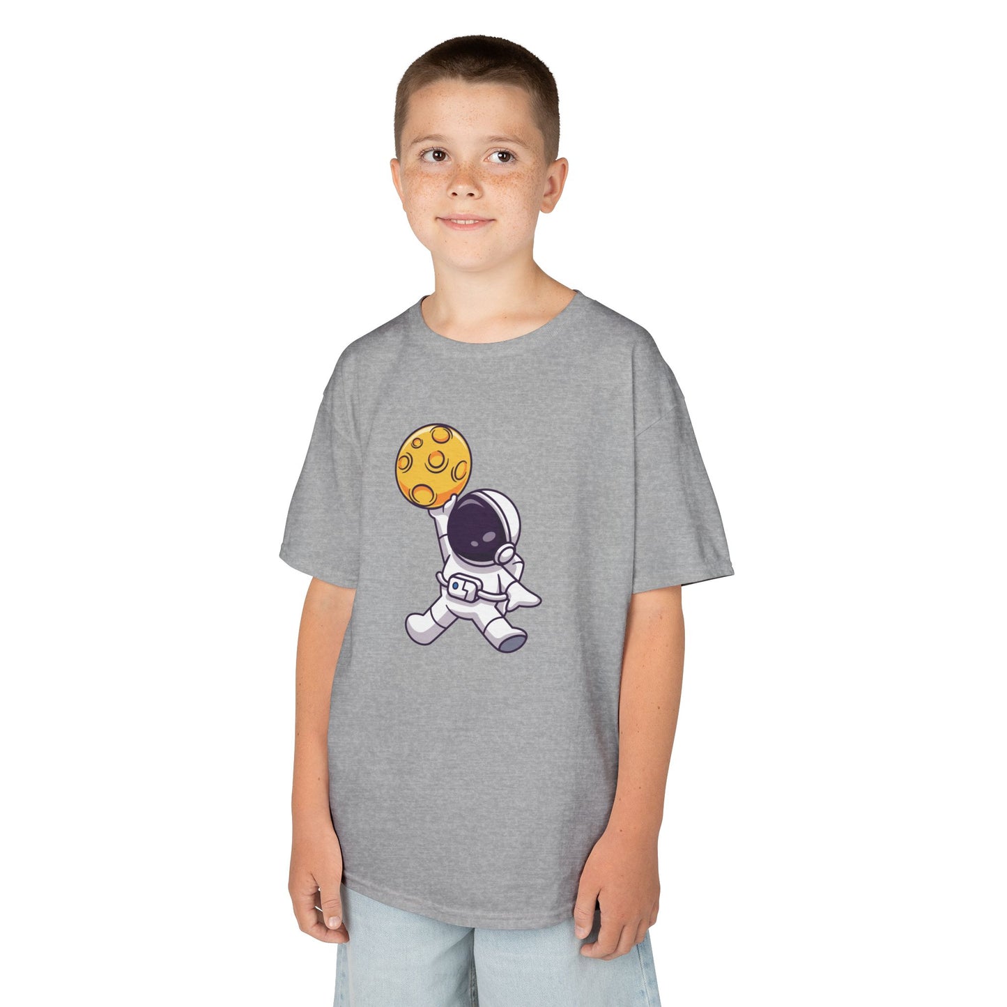 Boy wearing a gray "Dunking Astronaut" space basketball kids T-shirt with an astronaut dunking a planet-like basketball. Part of the Vivid Divergence Sensory Friendly Kids Shirts Range. The perfect T-shirt for sensory-sensitive kids and comes with a Sensory Satisfaction Promise.