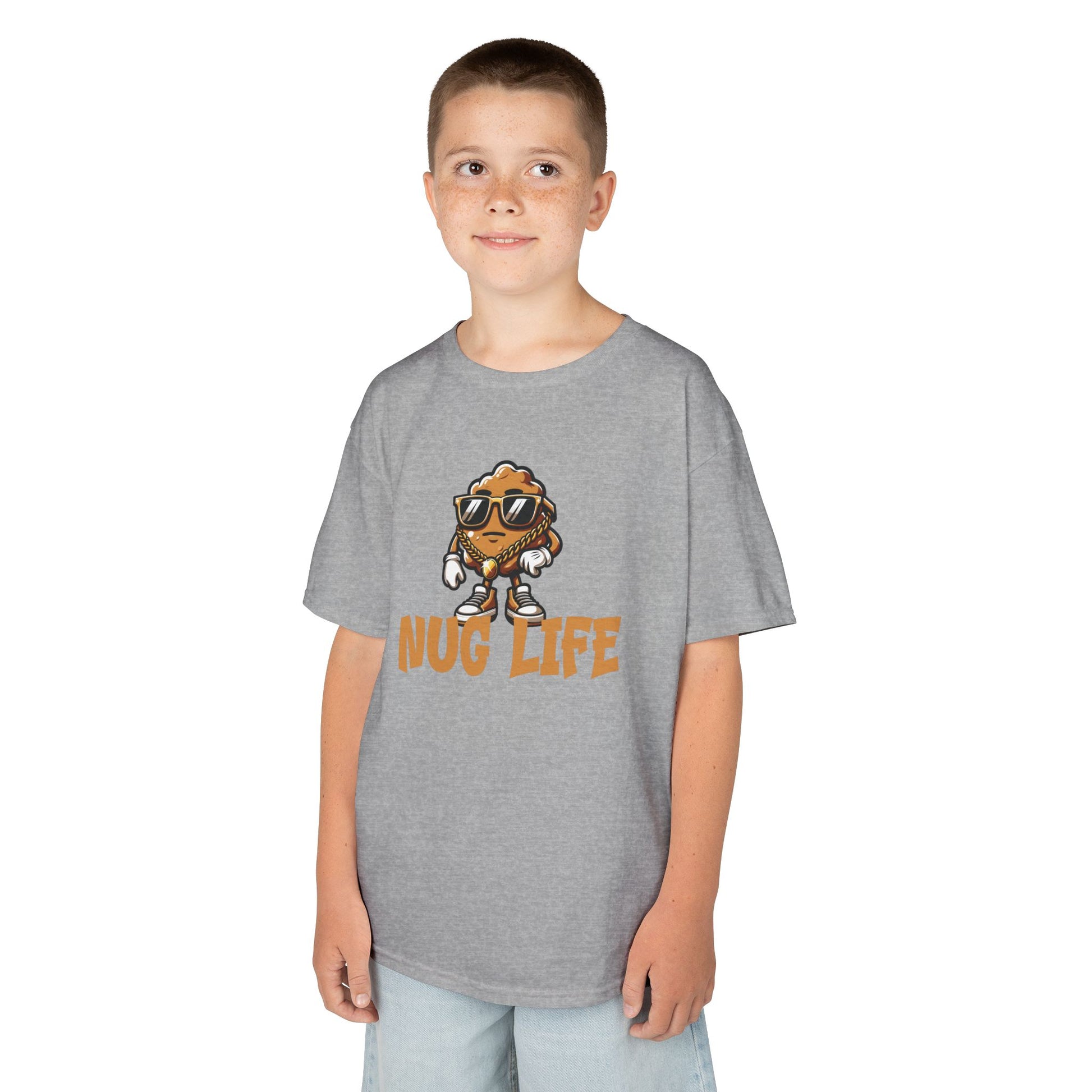 Boy wearing a gray "Nug Life" chicken nuggets kids T-shirt with a cool cartoon chicken nugget wearing sunglasses. Part of the Vivid Divergence Sensory Friendly Kids Shirts Range. The perfect T-shirt for sensory-sensitive kids and comes with a Sensory Satisfaction Promise.