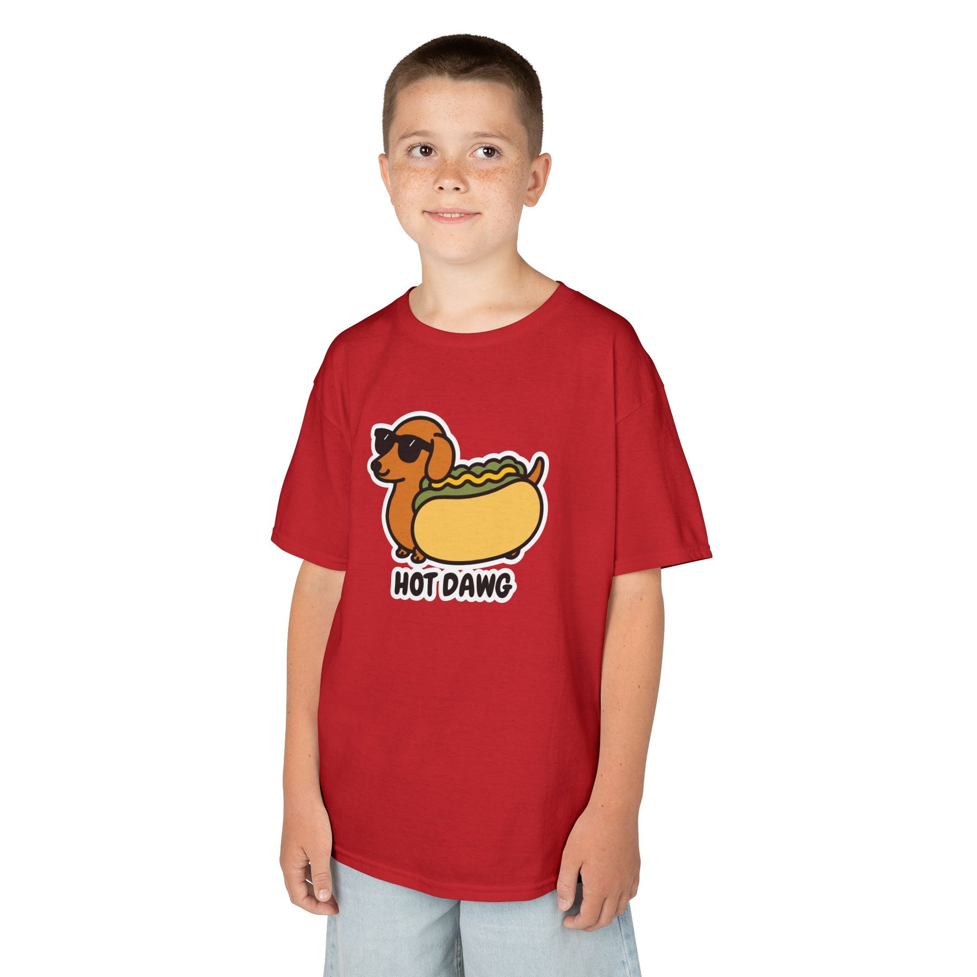 Boy wearing a red "Hot Dawg" kids T-shirt with a cartoon dachshund in a hot dog bun. Part of the Vivid Divergence Sensory Friendly Kids Shirts Range. The perfect T-shirt for sensory-sensitive kids and comes with a Sensory Satisfaction Promise.
