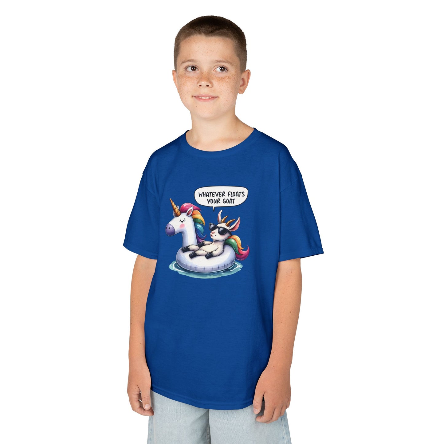 Boy wearing a royal blue "Whatever Floats Your Goat" kids T-shirt with a cartoon goat floating on a unicorn pool float. Part of the Vivid Divergence Sensory Friendly Kids Shirts Range. The perfect T-shirt for sensory-sensitive kids and comes with a Sensory Satisfaction Promise.