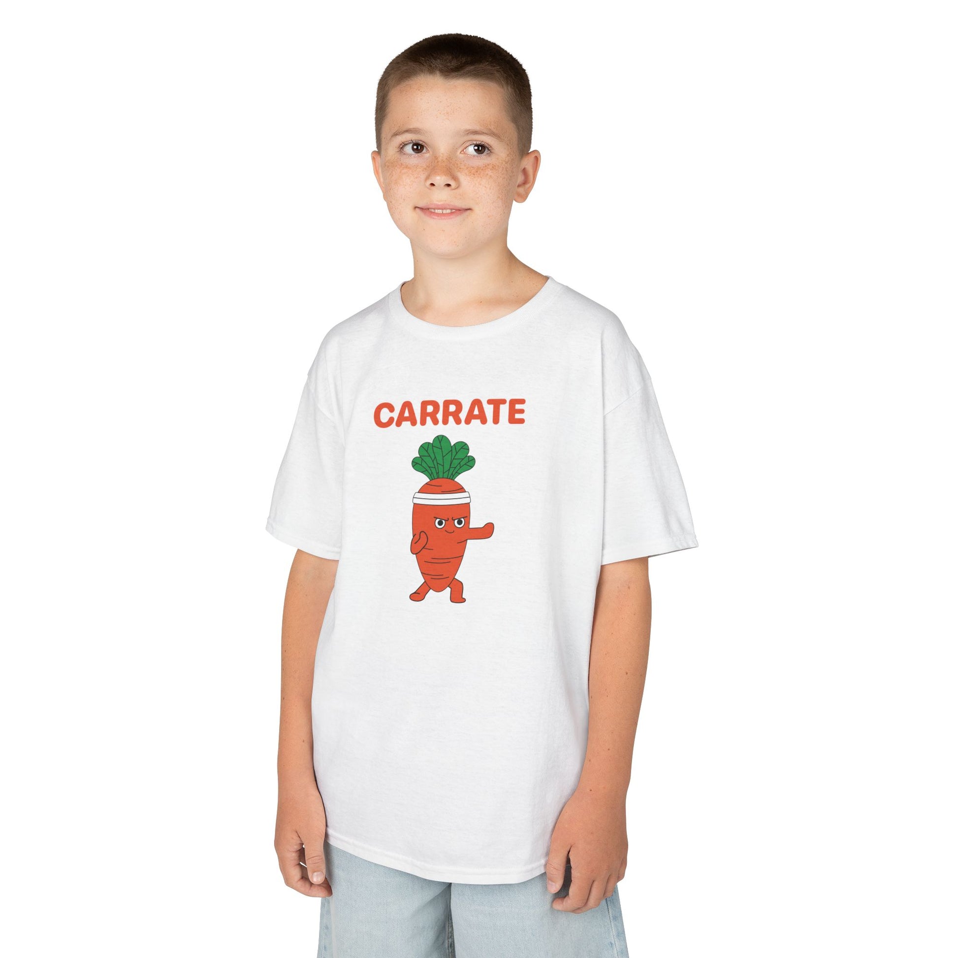 Boy wearing a white "Carrate" karate carrot kids T-shirt with a cartoon carrot in a karate pose. Part of the Vivid Divergence Sensory Friendly Kids Shirts Range. The perfect T-shirt for sensory-sensitive kids and comes with a Sensory Satisfaction Promise.