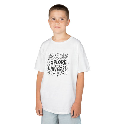 Boy wearing a white "Explore The Universe" kids T-shirt with a space-themed graphic. Part of the Vivid Divergence Sensory Friendly Kids Shirts Range. The perfect T-shirt for sensory-sensitive kids and comes with a Sensory Satisfaction Promise.