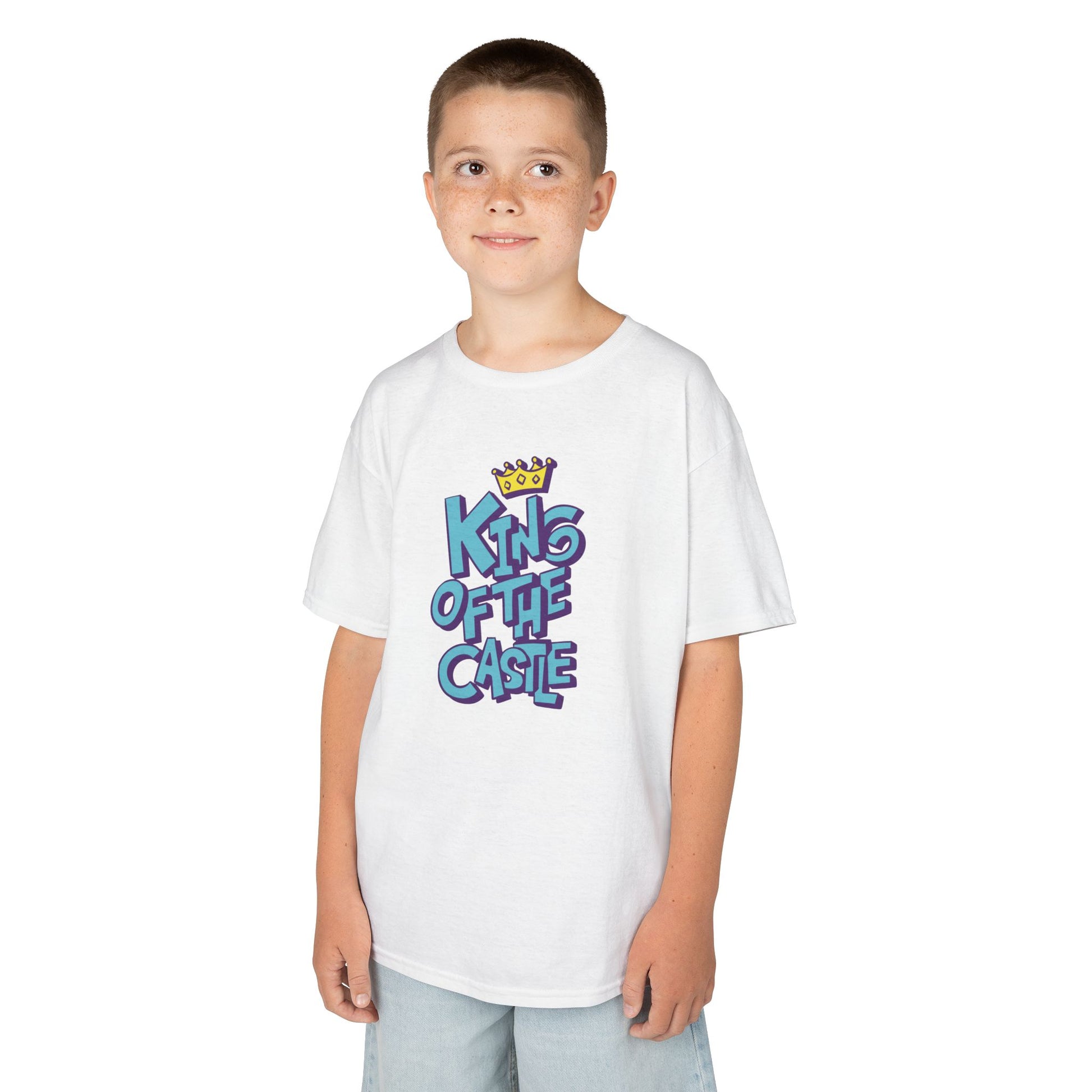 Boy wearing a white "King Of The Castle" kids T-shirt with bold blue text and a crown graphic. Part of the Vivid Divergence Sensory Friendly Kids Shirts Range. The perfect T-shirt for sensory-sensitive kids and comes with a Sensory Satisfaction Promise.