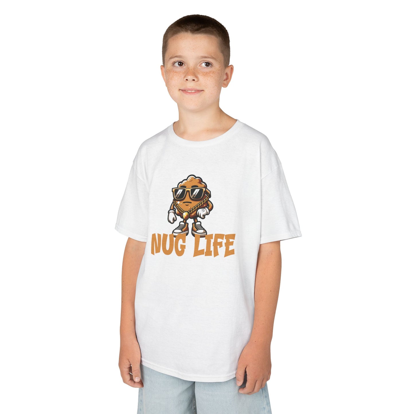 Boy wearing a white "Nug Life" chicken nuggets kids T-shirt with a cool cartoon chicken nugget wearing sunglasses. Part of the Vivid Divergence Sensory Friendly Kids Shirts Range. The perfect T-shirt for sensory-sensitive kids and comes with a Sensory Satisfaction Promise.