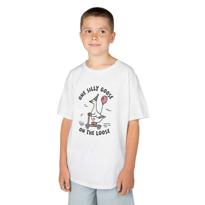 Boy wearing a white "One Silly Goose On The Loose" kids T-shirt with a playful cartoon goose. Part of the Vivid Divergence Sensory Friendly Kids Shirts Range. The perfect T-shirt for sensory-sensitive kids and comes with a Sensory Satisfaction Promise.
