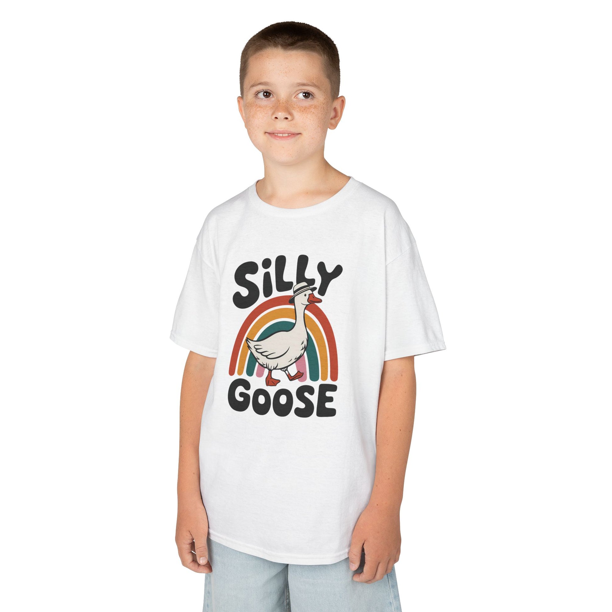 Boy wearing a white "Silly Goose" rainbow kids T-shirt with a cartoon goose and colorful rainbow. Part of the Vivid Divergence Sensory Friendly Kids Shirts Range. The perfect T-shirt for sensory-sensitive kids and comes with a Sensory Satisfaction Promise.