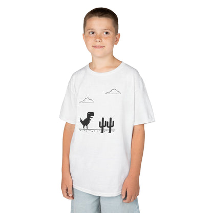 Boy wearing a white "T-Rex Runner" Dinosaur Game kids T-shirt with a pixelated T-Rex and cactus design. Part of the Vivid Divergence Sensory Friendly Kids Shirts Range. The perfect T-shirt for sensory-sensitive kids and comes with a Sensory Satisfaction Promise.