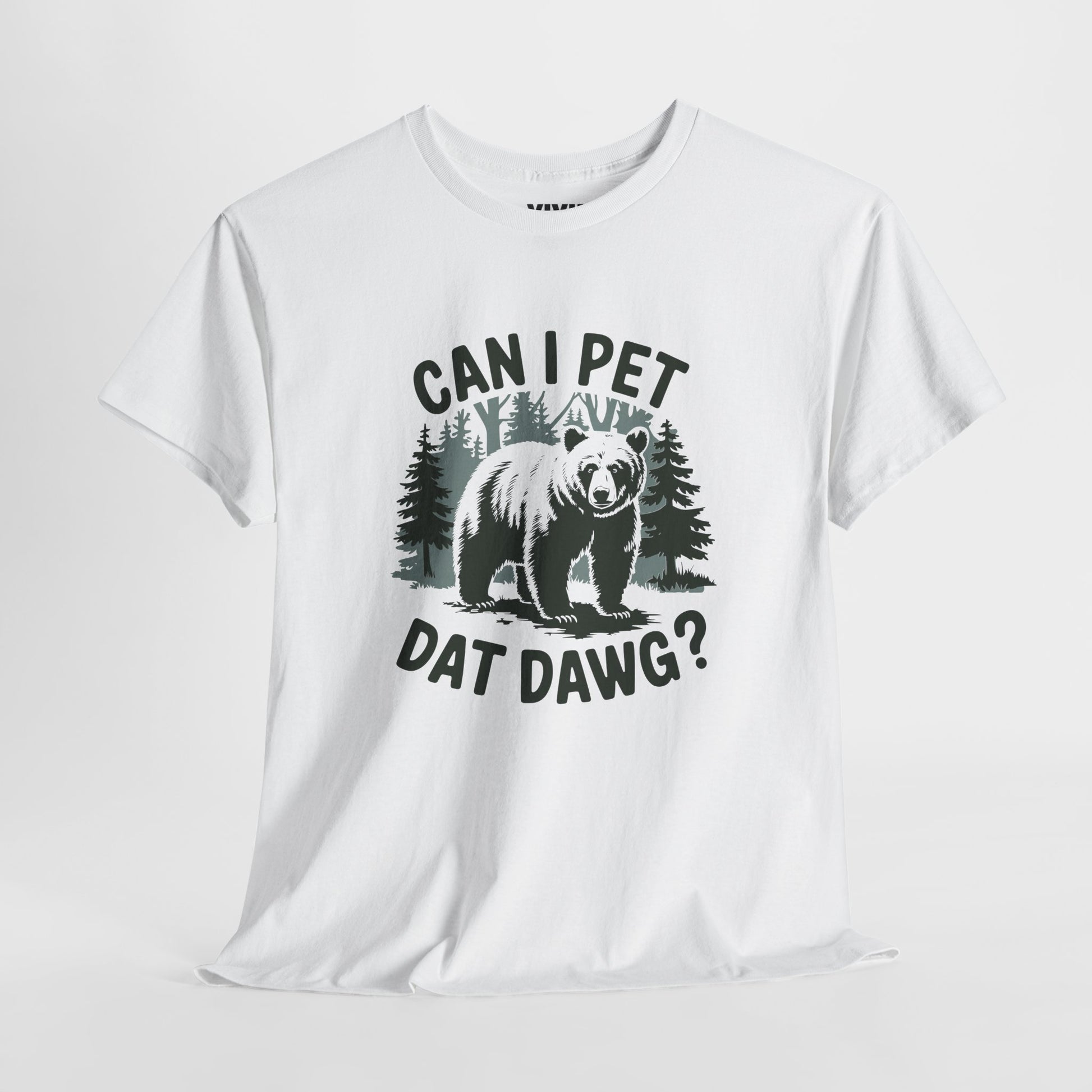 Angled view of white T-shirt showing graphic with trees and dog silhouette. Text reads “CAN I PET DAT DAWG?” in all caps. Part of the Vivid Divergence Memewear Collection!
