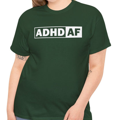 Model wearing a forest green T-shirt with bold "ADHD AF" text. Part of the Vivid Divergence Sensory Friendly Unisex Tees Range.