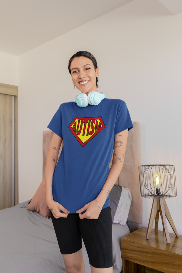 A person wearing a blue Autism Superpower T-shirt in a home setting, showcasing the sensory-friendly fit. Part of the Vivid Divergence Sensory Friendly Unisex Tees Range.