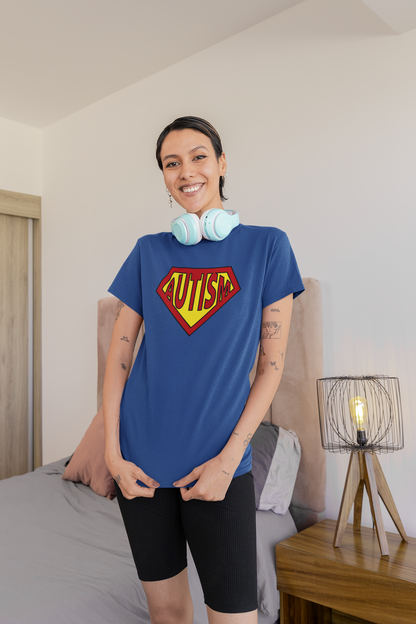 A person wearing a blue Autism Superpower T-shirt in a home setting, showcasing the sensory-friendly fit. Part of the Vivid Divergence Sensory Friendly Unisex Tees Range.