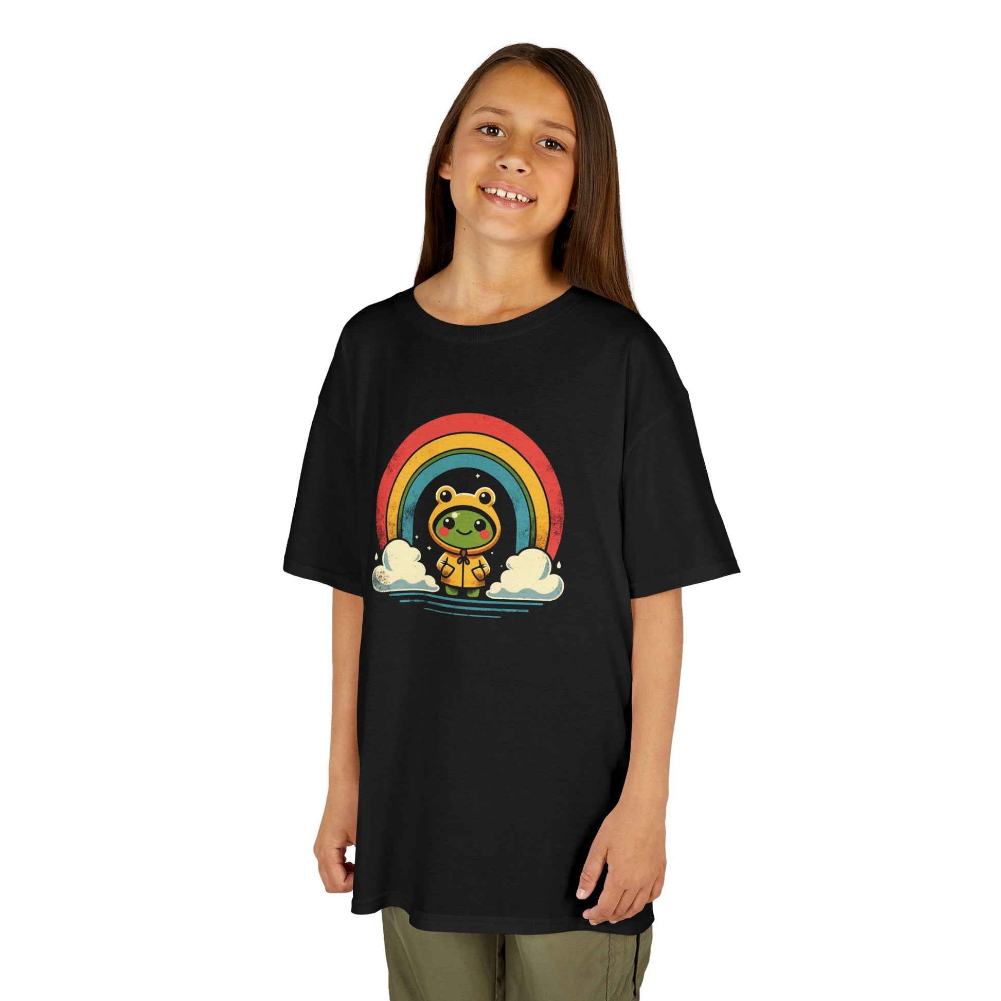 Girl wearing a black "Frog Under Rainbow" kids T-shirt with a cute frog sitting under a colorful rainbow. Part of the Vivid Divergence Sensory Friendly Kids Shirts Range. The perfect T-shirt for sensory-sensitive kids and comes with a Sensory Satisfaction Promise.