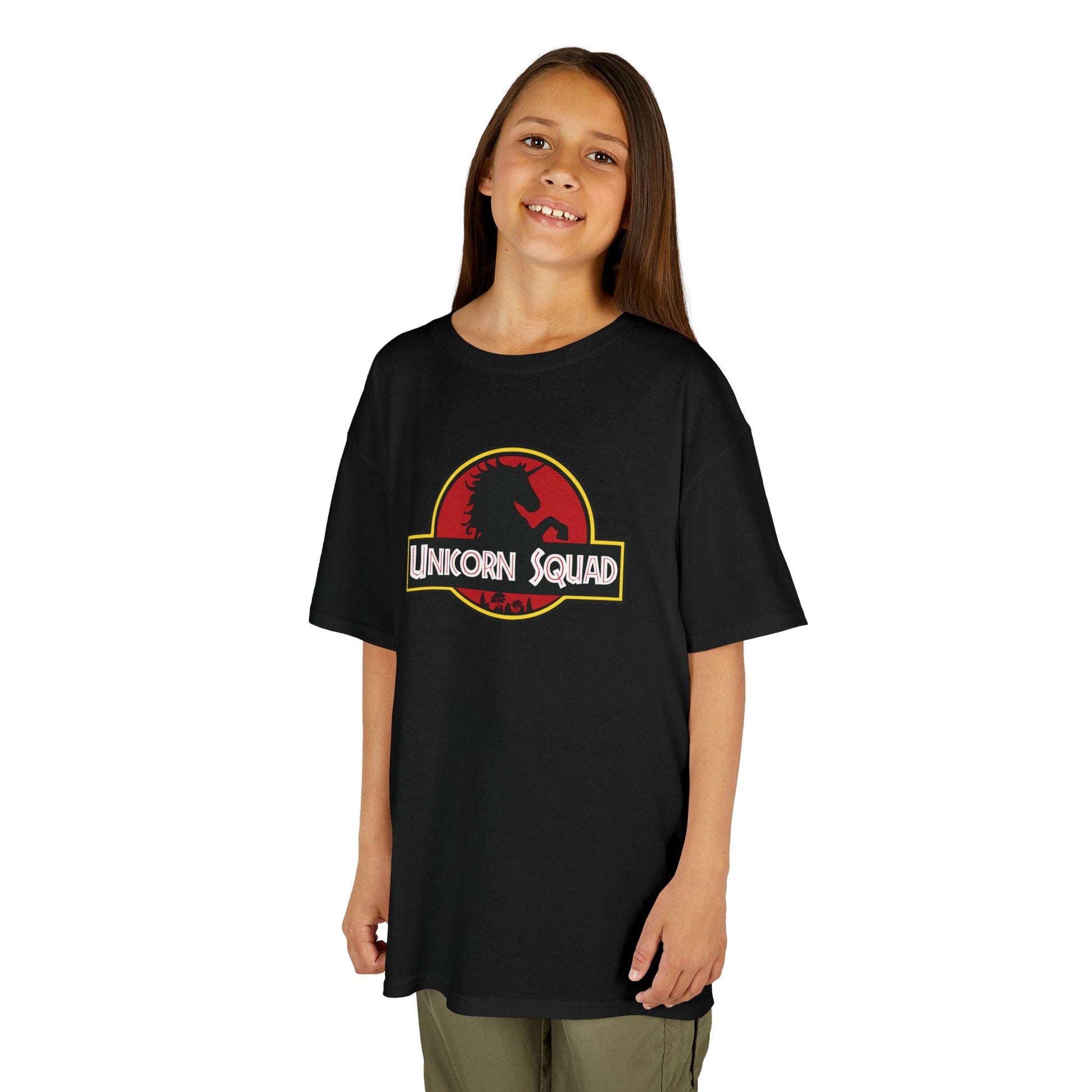 Girl wearing a black "Unicorn Squad" Jurassic Park parody kids T-shirt, front view. Part of the Vivid Divergence Sensory Friendly Kids Shirts Range. The perfect T-shirt for sensory-sensitive kids and comes with a Sensory Satisfaction Promise.