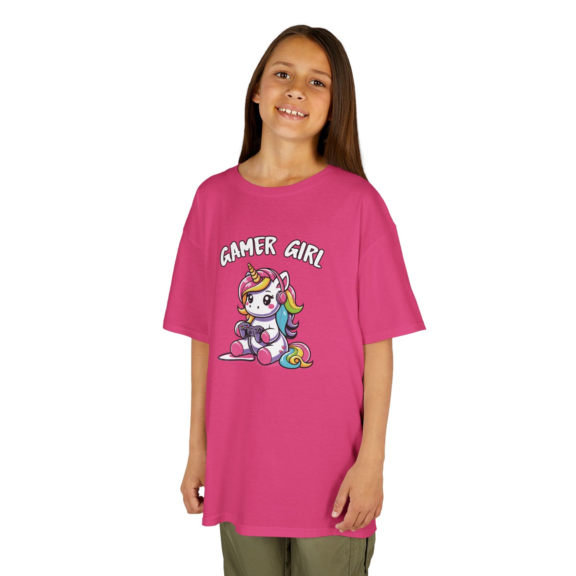 Girl wearing a hot pink "Gamer Girl" unicorn kids T-shirt with a unicorn holding gaming gear. Part of the Vivid Divergence Sensory Friendly Kids Shirts Range. The perfect T-shirt for sensory-sensitive kids and comes with a Sensory Satisfaction Promise.