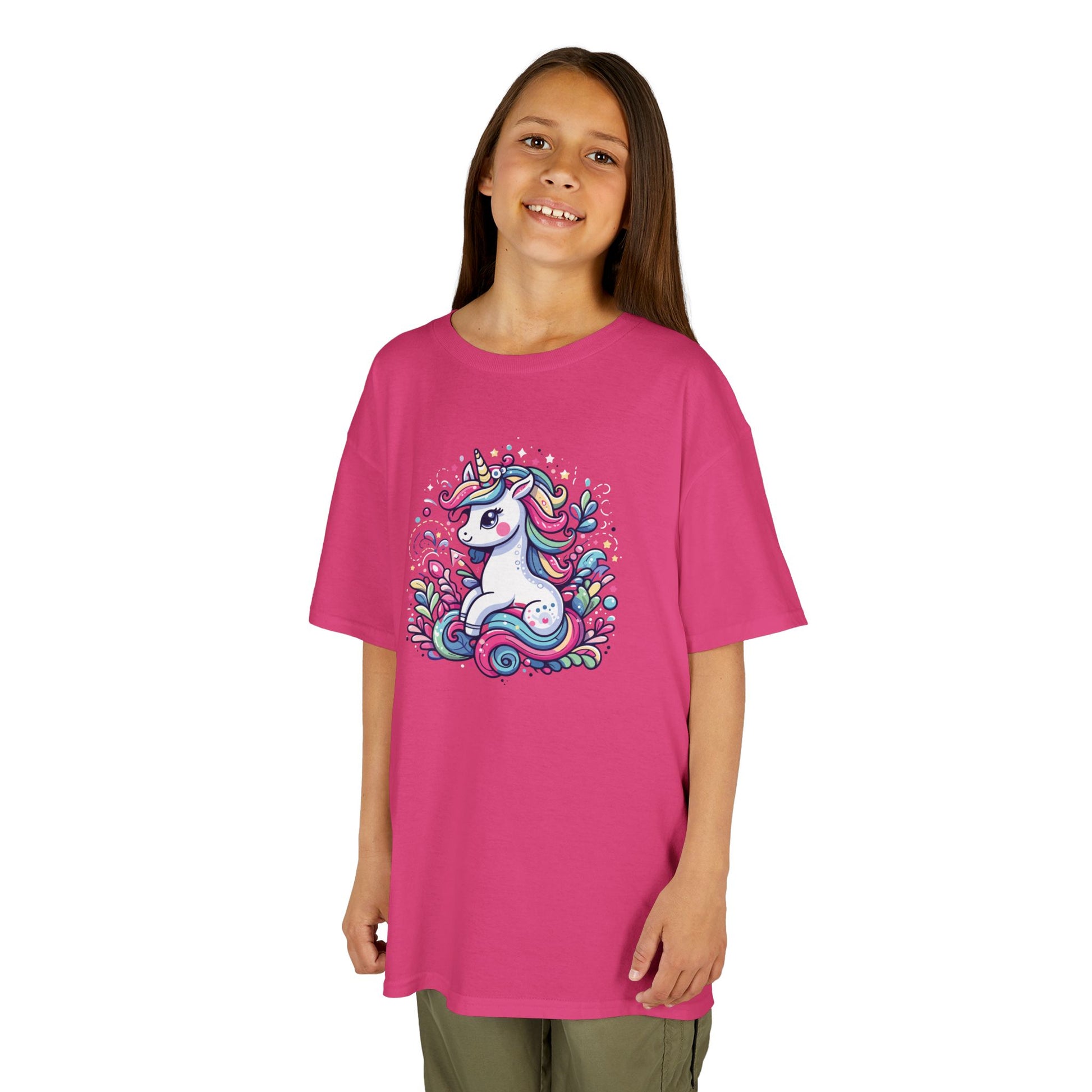 Girl wearing a hot pink "Unicorn Vibes" kids T-shirt with a colorful, whimsical unicorn design. Part of the Vivid Divergence Sensory Friendly Kids Shirts Range. The perfect T-shirt for sensory-sensitive kids and comes with a Sensory Satisfaction Promise.