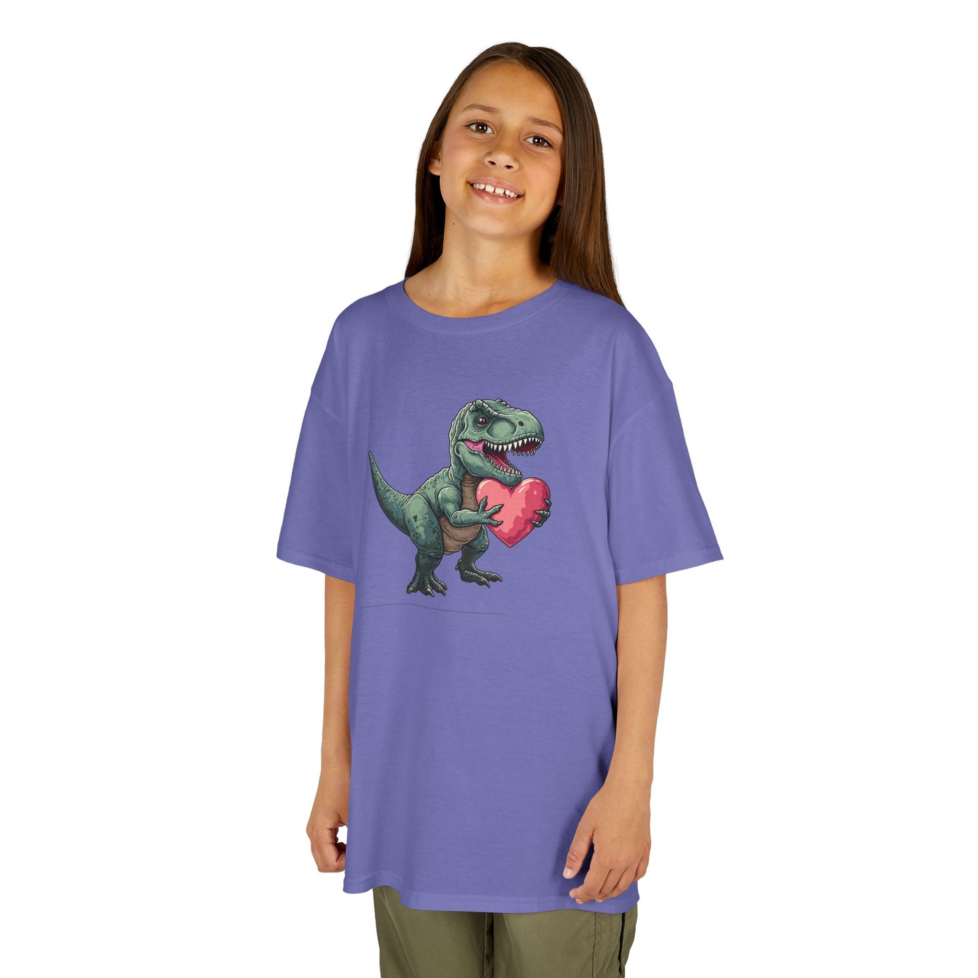 Girl wearing a lavender T-Rex Love kids T-shirt with a cartoon dinosaur holding a heart. Part of the Vivid Divergence Sensory Friendly Kids Shirts Range. The perfect T-shirt for sensory-sensitive kids and comes with a Sensory Satisfaction Promise.