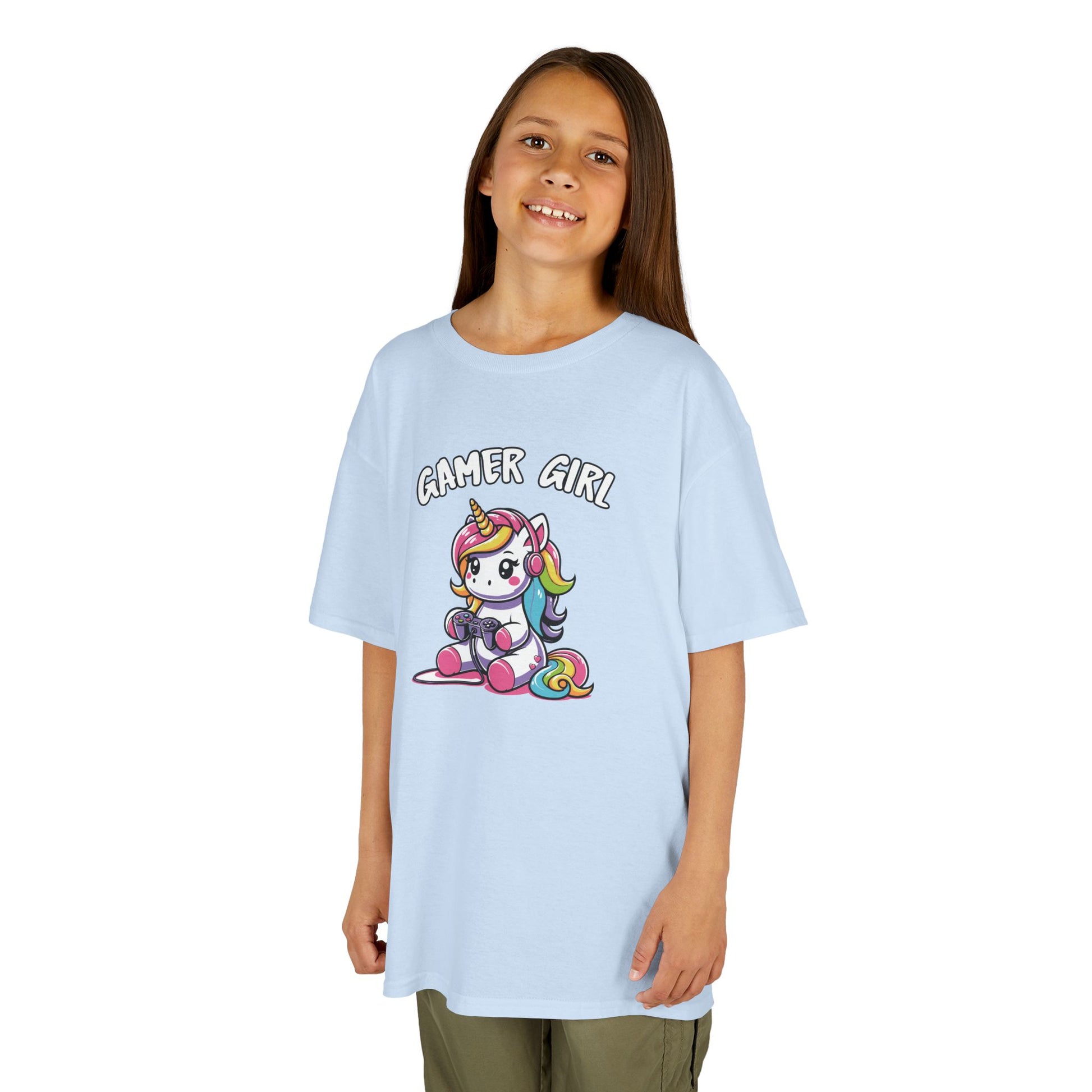 Girl wearing a light blue "Gamer Girl" unicorn kids T-shirt with a unicorn holding gaming gear. Part of the Vivid Divergence Sensory Friendly Kids Shirts Range. The perfect T-shirt for sensory-sensitive kids and comes with a Sensory Satisfaction Promise.