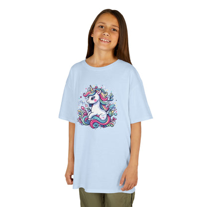 Girl wearing a light blue "Unicorn Vibes" kids T-shirt with a colorful, whimsical unicorn design. Part of the Vivid Divergence Sensory Friendly Kids Shirts Range. The perfect T-shirt for sensory-sensitive kids and comes with a Sensory Satisfaction Promise.