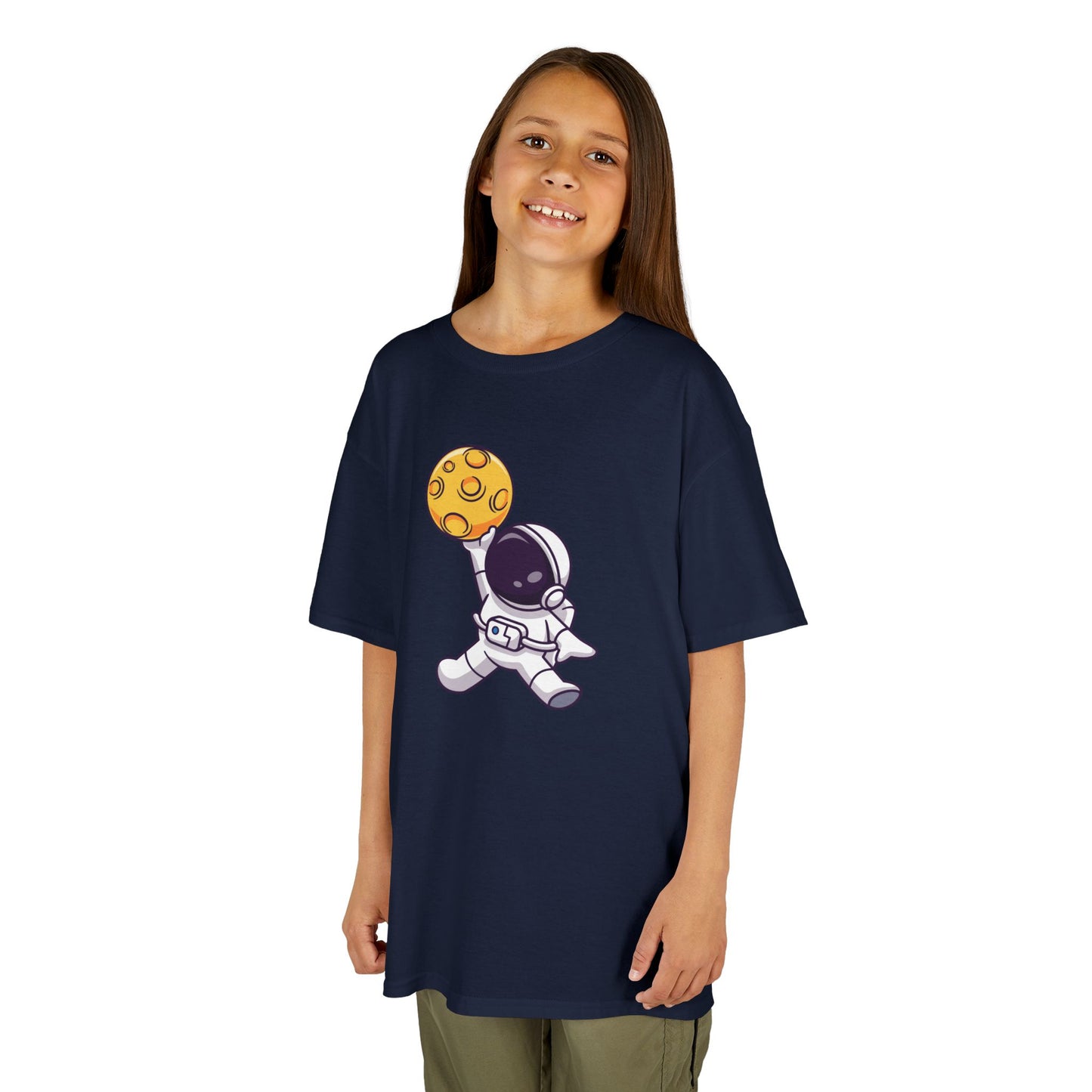 Girl wearing a navy blue "Dunking Astronaut" space basketball kids T-shirt with an astronaut dunking a planet-like basketball. Part of the Vivid Divergence Sensory Friendly Kids Shirts Range. The perfect T-shirt for sensory-sensitive kids and comes with a Sensory Satisfaction Promise.