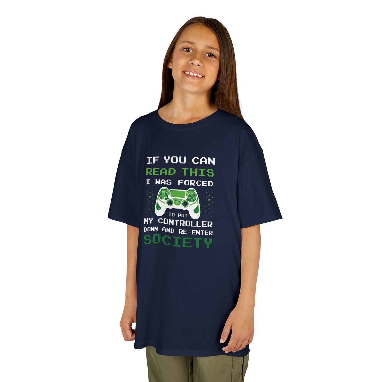 Girl wearing a navy blue "Forced to Put My Controller Down" kids T-shirt with a green game controller graphic and humorous text. Part of the Vivid Divergence Sensory Friendly Kids Shirts Range. The perfect T-shirt for sensory-sensitive kids and comes with a Sensory Satisfaction Promise.