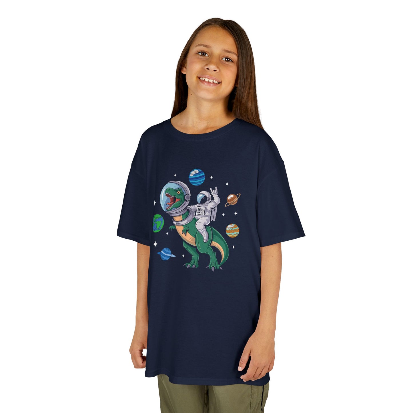 Girl wearing a navy blue "Jurassic Space Jam" kids T-shirt with a dinosaur and astronaut floating among planets. Part of the Vivid Divergence Sensory Friendly Kids Shirts Range. The perfect T-shirt for sensory-sensitive kids and comes with a Sensory Satisfaction Promise.