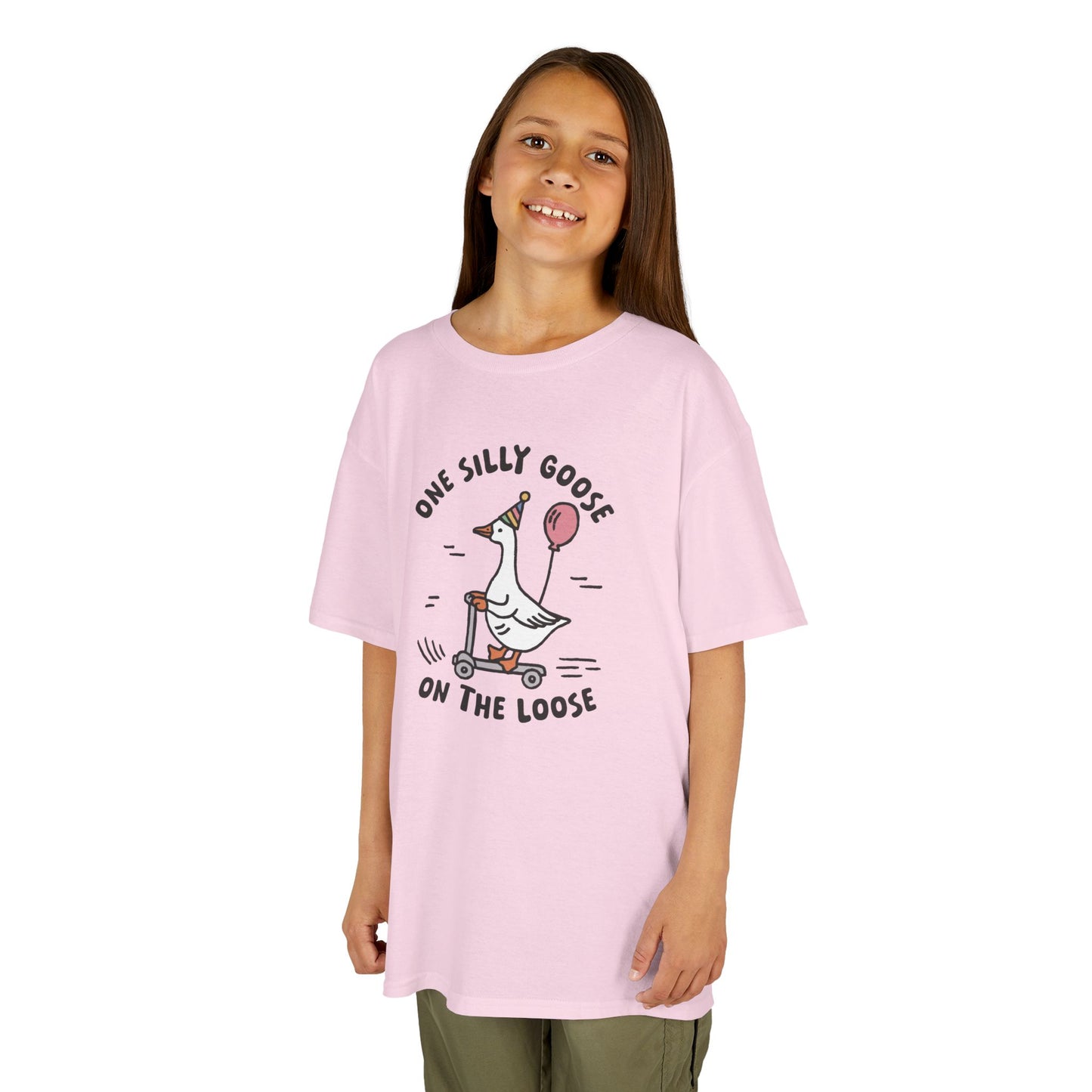 Girl wearing a pink "One Silly Goose On The Loose" kids T-shirt with a playful cartoon goose. Part of the Vivid Divergence Sensory Friendly Kids Shirts Range. The perfect T-shirt for sensory-sensitive kids and comes with a Sensory Satisfaction Promise.