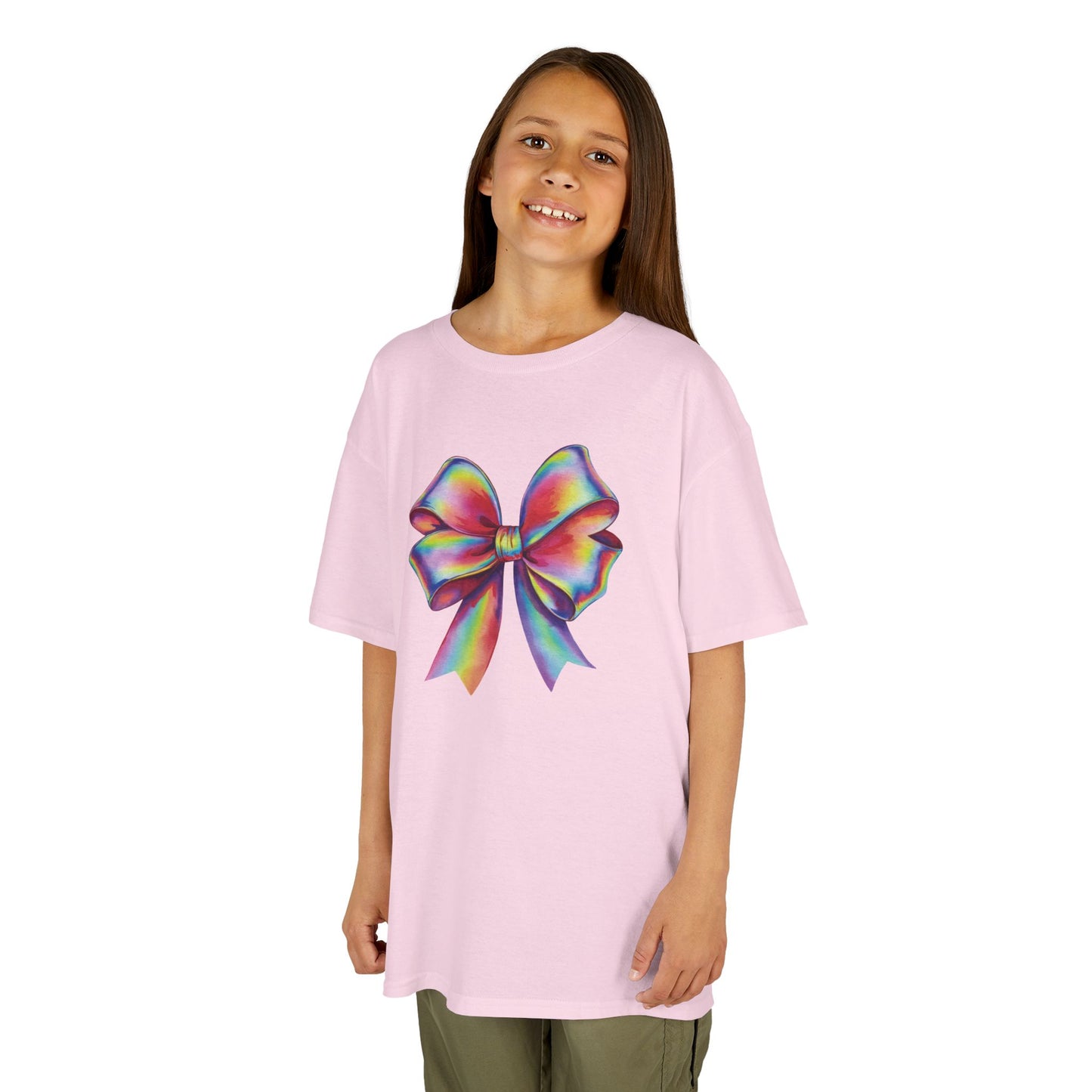 Girl wearing a pink "Rainbow Holographic Bow" kids T-shirt with a colorful holographic bow graphic. Part of the Vivid Divergence Sensory Friendly Kids Shirts Range. The perfect T-shirt for sensory-sensitive kids and comes with a Sensory Satisfaction Promise.