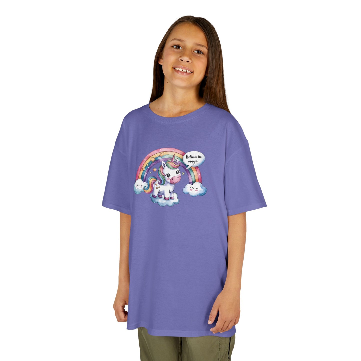 Girl wearing a purple "Believe In Magic" unicorn kids T-shirt with a colorful unicorn under a rainbow. Part of the Vivid Divergence Sensory Friendly Kids Shirts Range. The perfect T-shirt for sensory-sensitive kids and comes with a Sensory Satisfaction Promise.