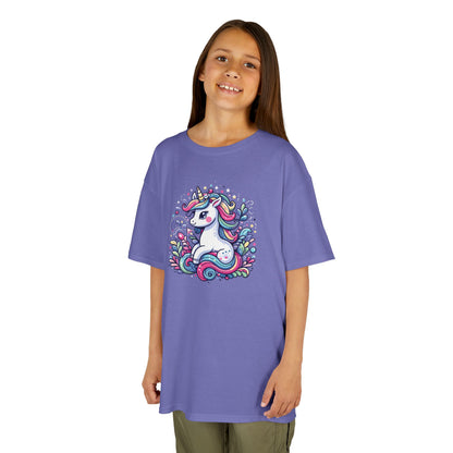 Girl wearing a purple "Unicorn Vibes" kids T-shirt with a colorful, whimsical unicorn design. Part of the Vivid Divergence Sensory Friendly Kids Shirts Range. The perfect T-shirt for sensory-sensitive kids and comes with a Sensory Satisfaction Promise.