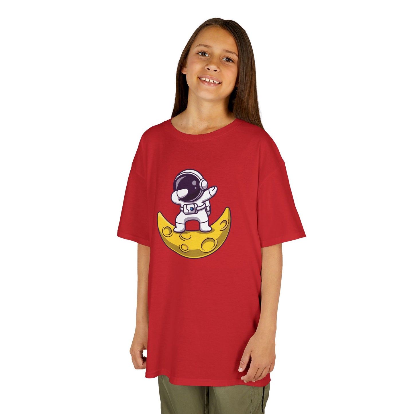 Girl wearing a red "Dabbing Astronaut on the Moon" kids T-shirt with an astronaut dabbing while sitting on a crescent moon. Part of the Vivid Divergence Sensory Friendly Kids Shirts Range. The perfect T-shirt for sensory-sensitive kids and comes with a Sensory Satisfaction Promise.