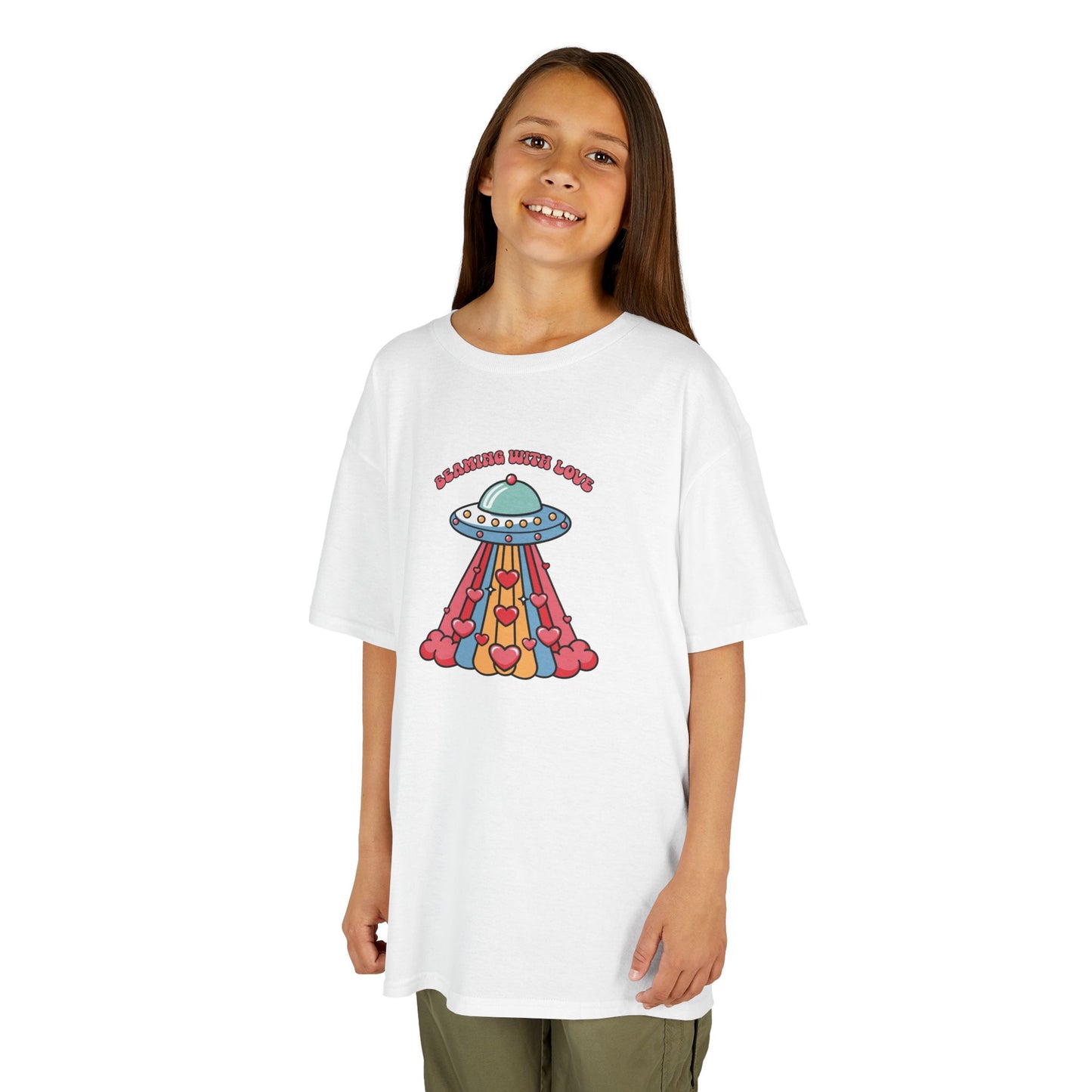 Girl wearing a white "Beaming With Love" kids T-shirt with a colorful UFO beaming down hearts. Part of the Vivid Divergence Sensory Friendly Kids Shirts Range. The perfect T-shirt for sensory-sensitive kids and comes with a Sensory Satisfaction Promise.