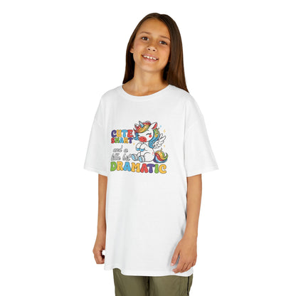 Girl wearing a white "Cute, Smart, and a Little Bit Dramatic" unicorn kids T-shirt with a colorful unicorn graphic and playful text. Part of the Vivid Divergence Sensory Friendly Kids Shirts Range. The perfect T-shirt for sensory-sensitive kids and comes with a Sensory Satisfaction Promise.