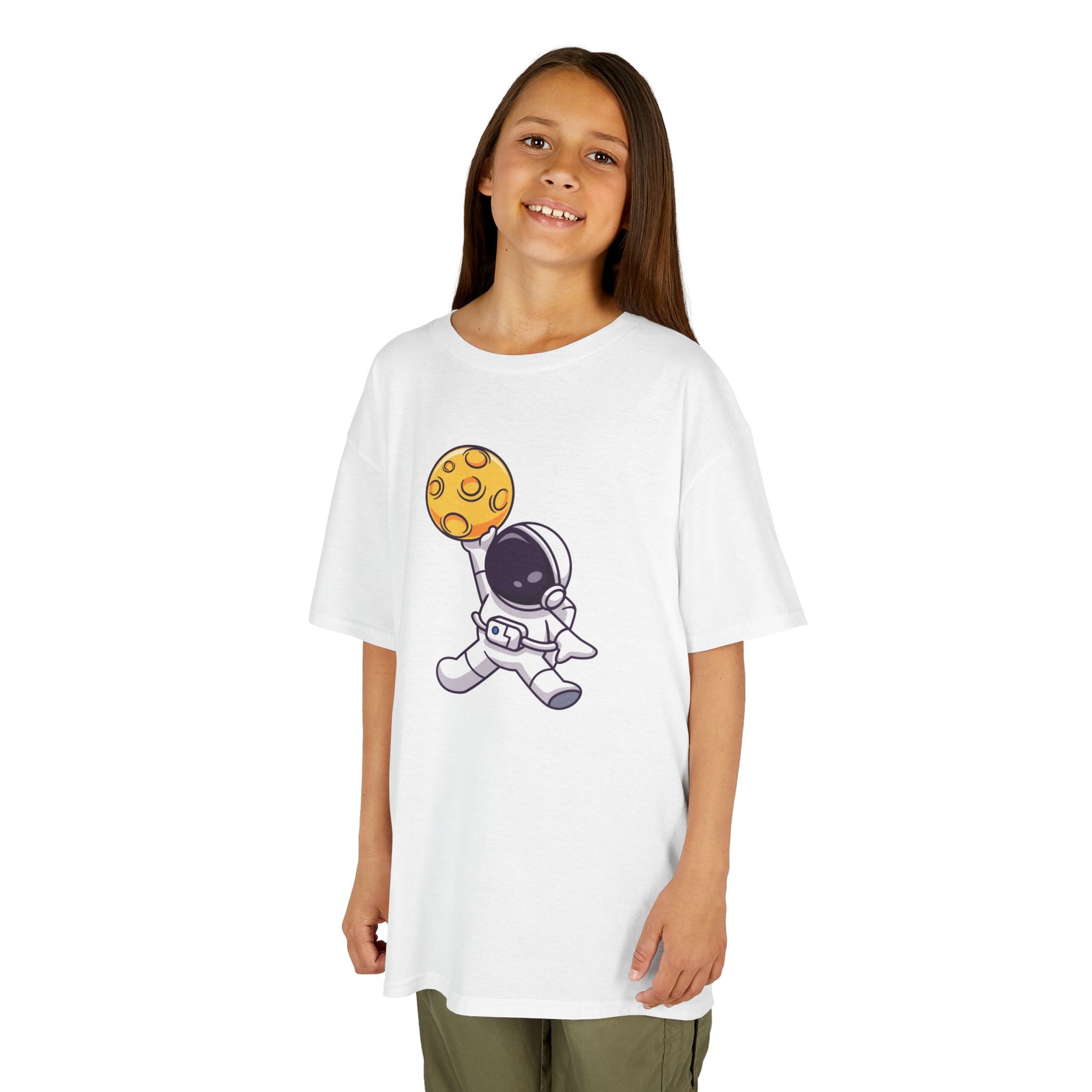 Girl wearing a white "Dunking Astronaut" space basketball kids T-shirt with an astronaut dunking a planet-like basketball. Part of the Vivid Divergence Sensory Friendly Kids Shirts Range. The perfect T-shirt for sensory-sensitive kids and comes with a Sensory Satisfaction Promise.