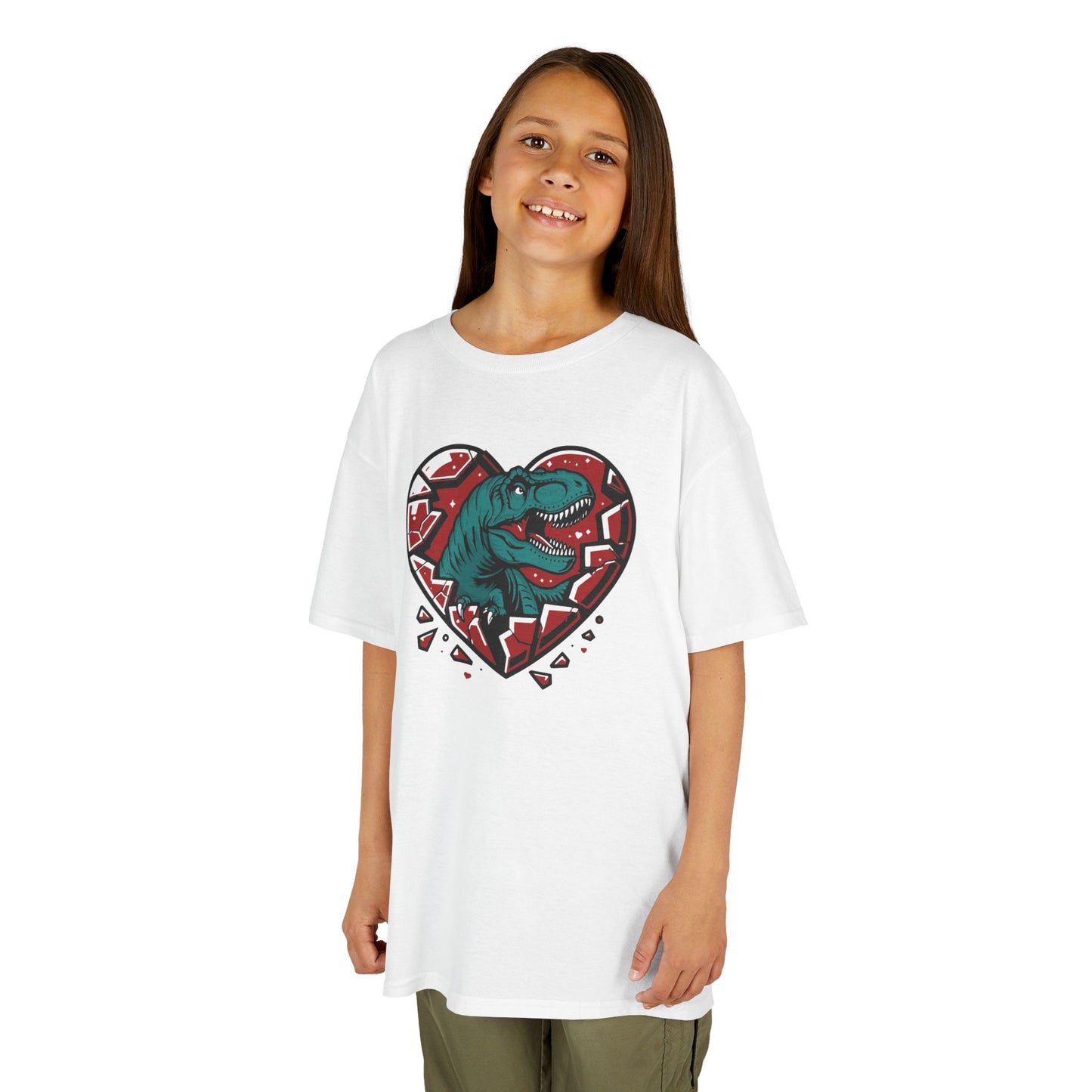 Girl wearing a white "Jurassic Heart" kids T-shirt with a dinosaur inside a heart graphic. Part of the Vivid Divergence Sensory Friendly Kids Shirts Range. The perfect T-shirt for sensory-sensitive kids and comes with a Sensory Satisfaction Promise.