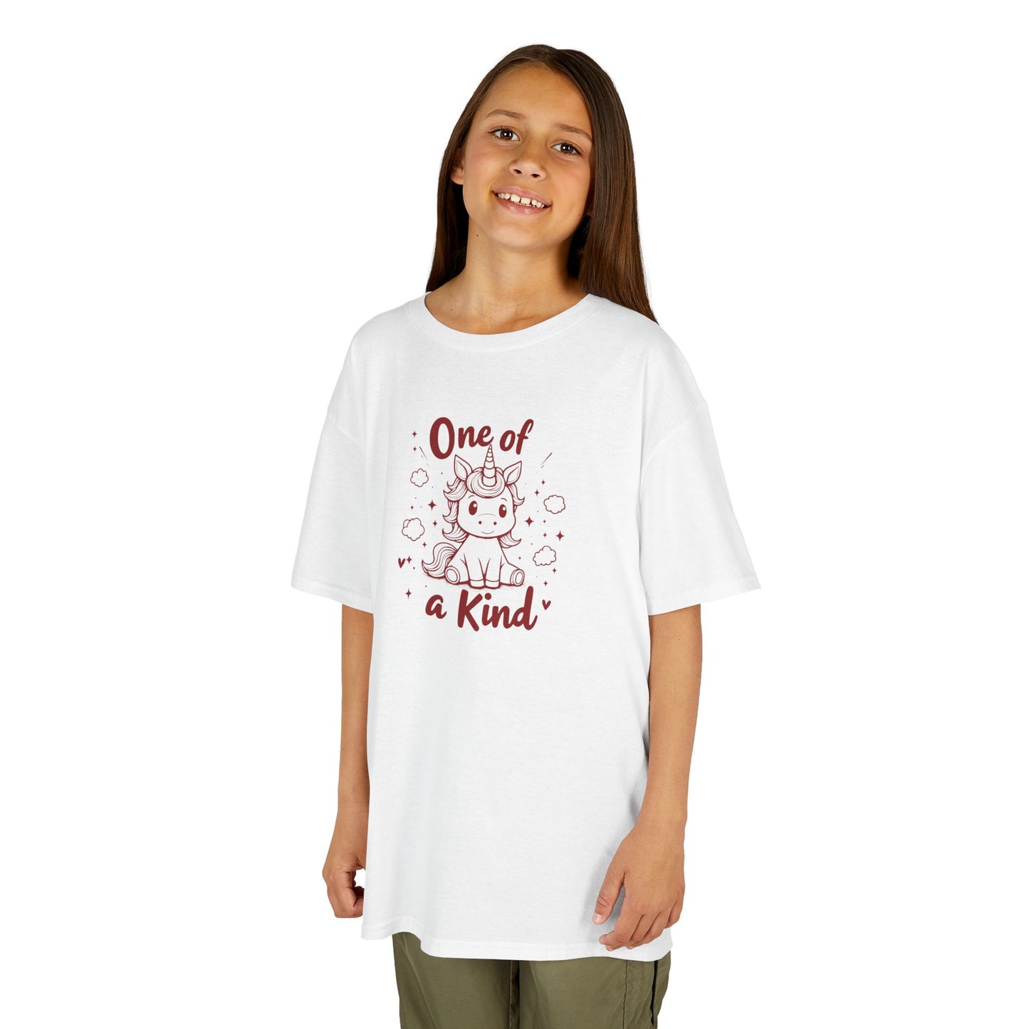 Girl wearing a white "One of a Kind" unicorn kids T-shirt with a cute unicorn graphic. Part of the Vivid Divergence Sensory Friendly Kids Shirts Range. The perfect T-shirt for sensory-sensitive kids and comes with a Sensory Satisfaction Promise.