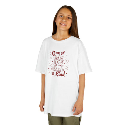 Girl wearing a white "One of a Kind" unicorn kids T-shirt with a cute unicorn graphic. Part of the Vivid Divergence Sensory Friendly Kids Shirts Range. The perfect T-shirt for sensory-sensitive kids and comes with a Sensory Satisfaction Promise.