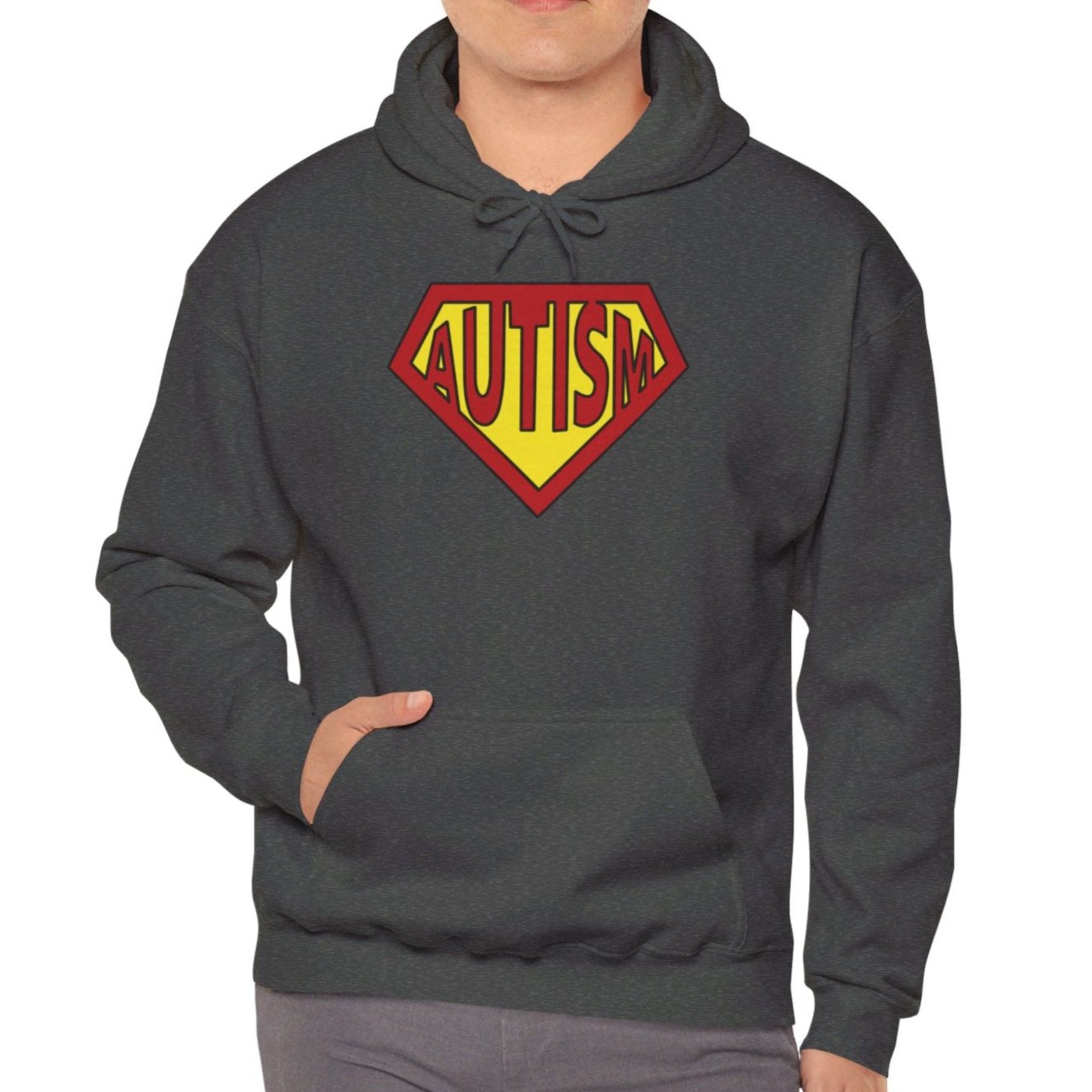Model wearing a gray hoodie featuring the text "Autism" inside a Superman-style red and yellow shield design. Part of the Vivid Divergence Sensory Friendly Unisex Hoodie Range.