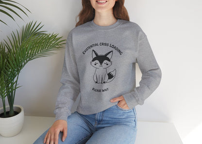 Model wearing a gray sweater jumper with the text "Existential Crisis Loading, Please Wait" and a cartoon fox illustration. Part of the Vivid Divergence Sensory Friendly Unisex Sweater Jumper Range.