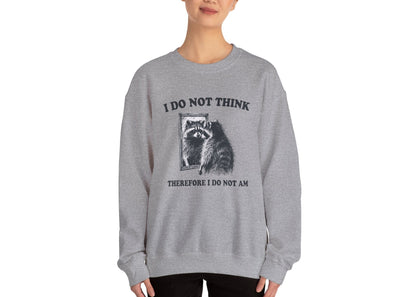 Model wearing a gray sweater jumper with the text "I Do Not Think, Therefore I Do Not Am" and a cartoon raccoon illustration. Part of the Vivid Divergence Sensory Friendly Unisex Sweater Jumper Range.