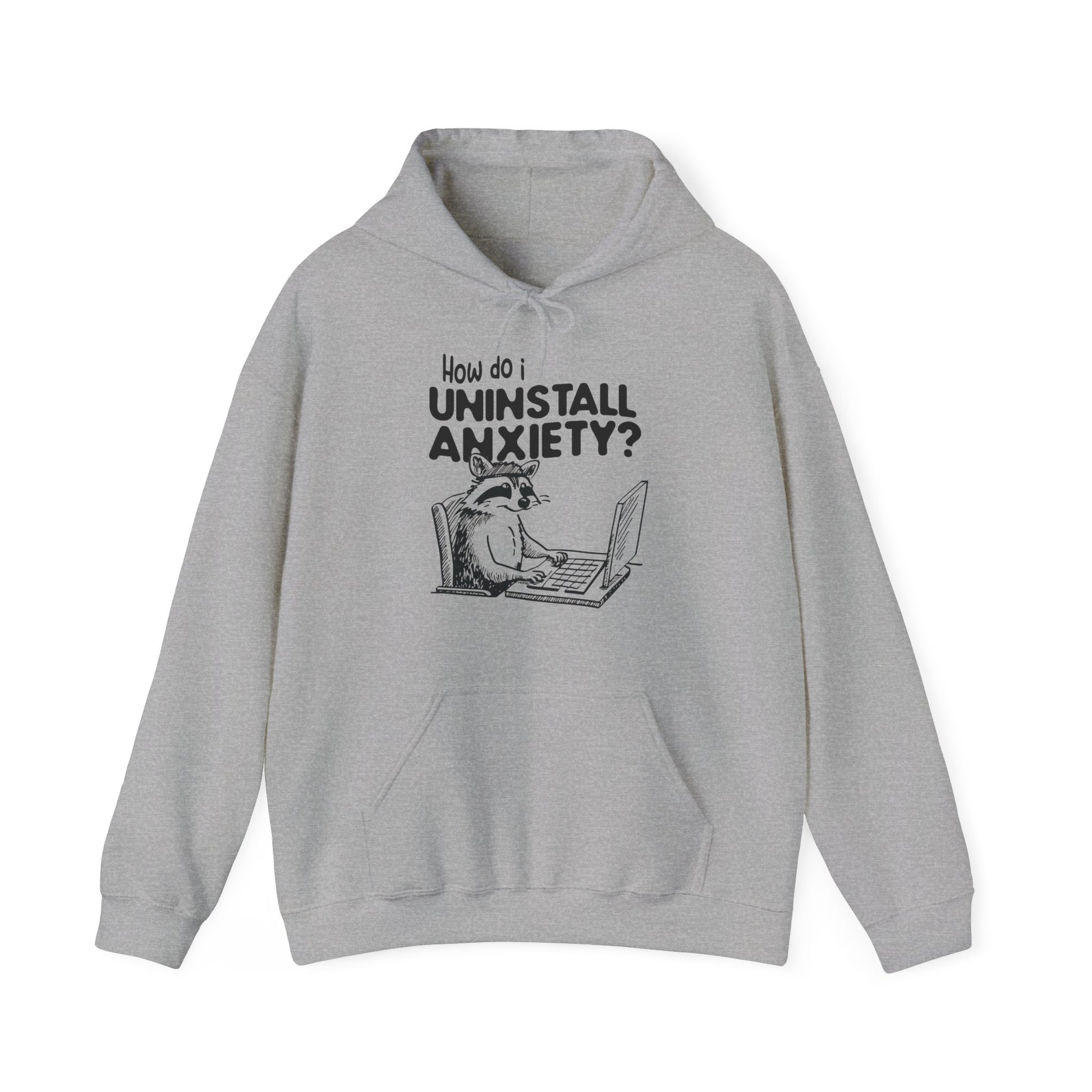 Front view of a gray hoodie featuring the text "How Do I Uninstall Anxiety?" and a cartoon illustration of a raccoon using a laptop. Part of the Vivid Divergence Sensory Friendly Unisex Hoodie Range.