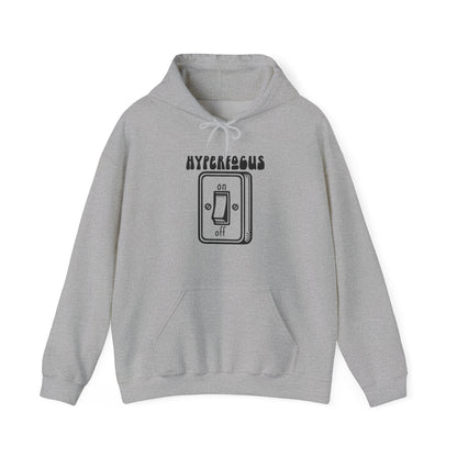 Front view of a gray hoodie featuring the text "Hyperfocus" and an illustration of a toggle switch turned on. Part of the Vivid Divergence Sensory Friendly Unisex Hoodie Range.