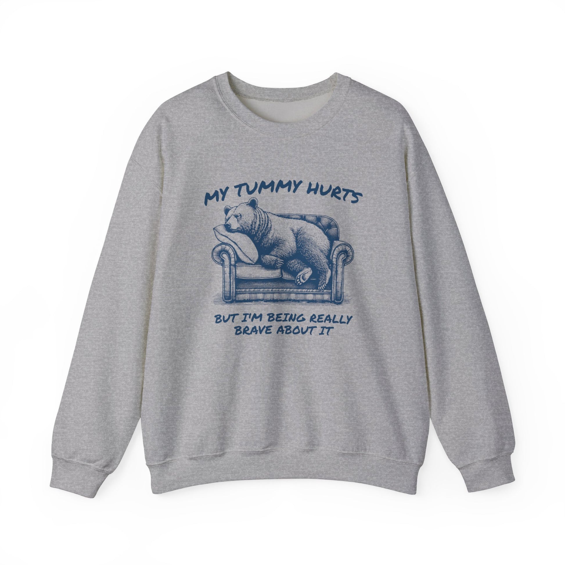 Front view of a gray sweater jumper with the text "My Tummy Hurts But I’m Being Really Brave About It" and a cartoon illustration of a bear holding its stomach. Part of the Vivid Divergence Sensory Friendly Unisex Sweater Jumper Range.