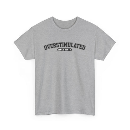 Front view of a light gray T-shirt with "Overstimulated Since Birth" in bold black text. Part of the Vivid Divergence Sensory Friendly Unisex Tees Range.