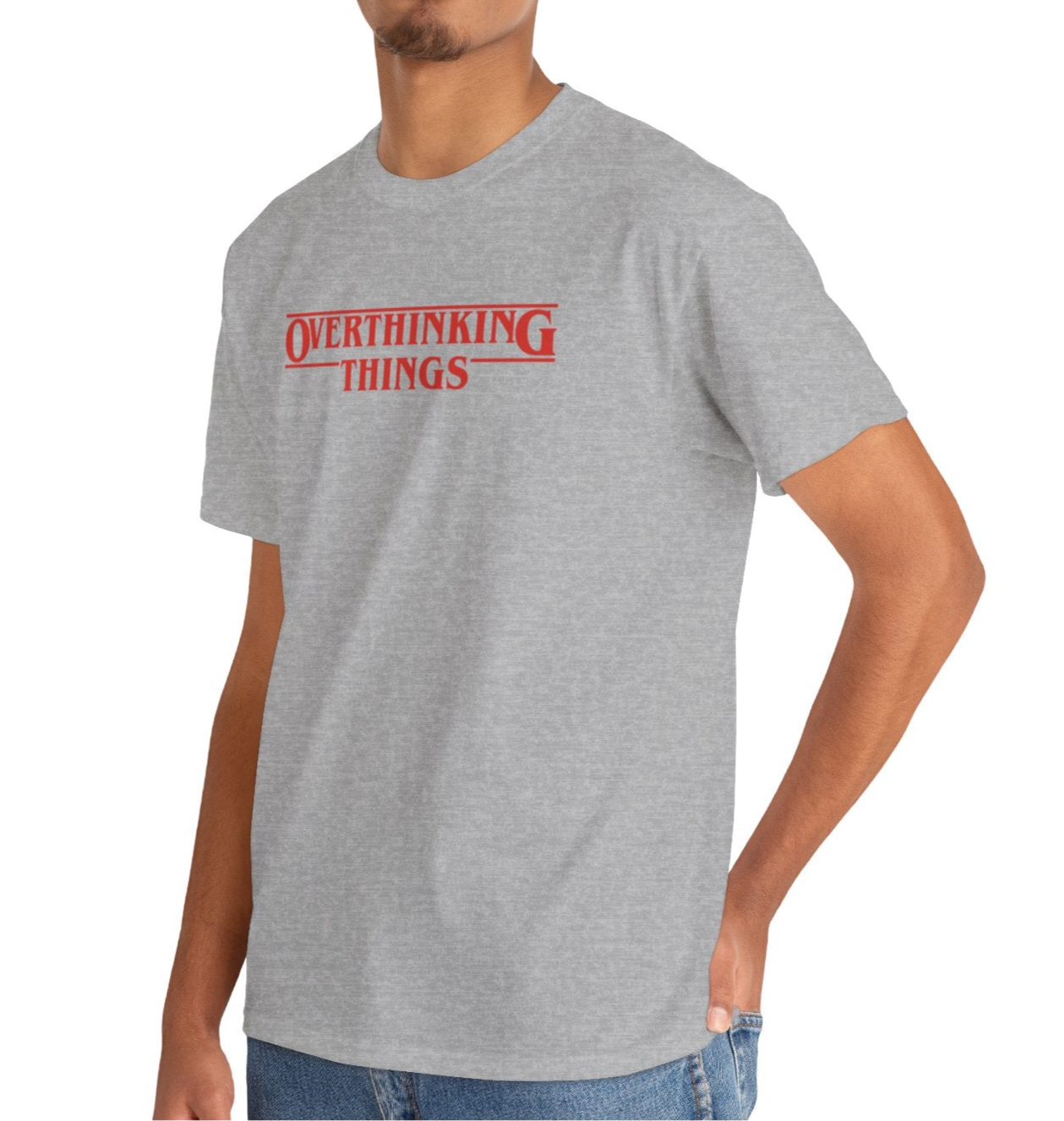 Model wearing a gray T-shirt with "Overthinking Things" in red text, parodying Stranger Things. Part of the Vivid Divergence Sensory Friendly Unisex Tees Range.