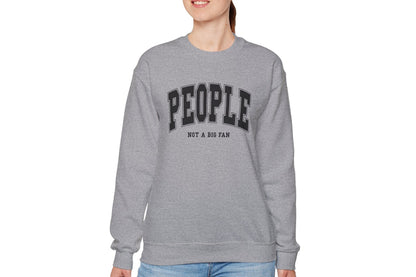 Model wearing a gray sweater jumper with the text "People. Not a Big Fan" in bold white lettering. Part of the Vivid Divergence Sensory Friendly Unisex Sweater Jumper Range.