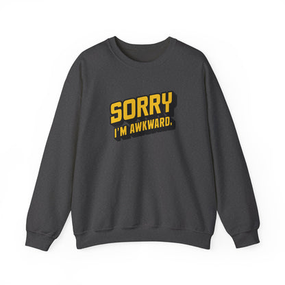 Front view of a gray sweater jumper with the text "Sorry, I'm Awkward." in bold yellow lettering. Part of the Vivid Divergence Sensory Friendly Unisex Sweater Jumper Range.